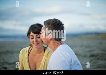 Married couple enjoy romantic day at beach. Stock Photo