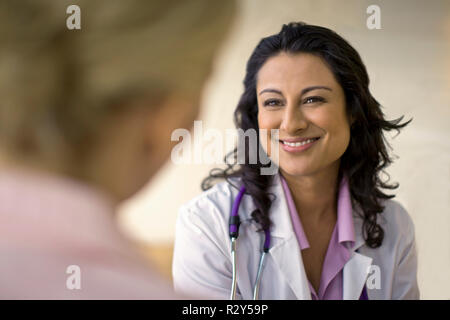 Smiling doctor in conversation Stock Photo