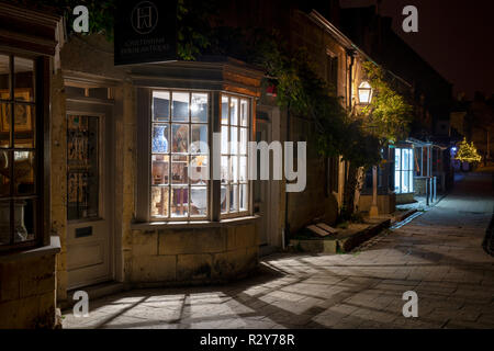 Cheltenham house antiques shop at night. Broadway, Cotswolds, Worcestershire, England Stock Photo
