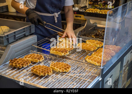 Woman baking traditional Brussels waffles Stock Photo