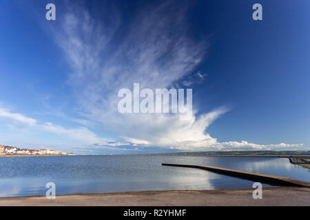 Jetty on the Marine Lake at West Kirby, with cirrus clouds, England Stock Photo