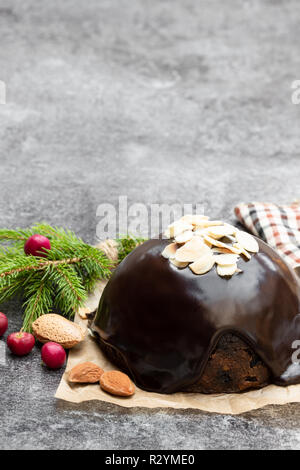 Homemade  Christmas pudding on gray stone background Stock Photo