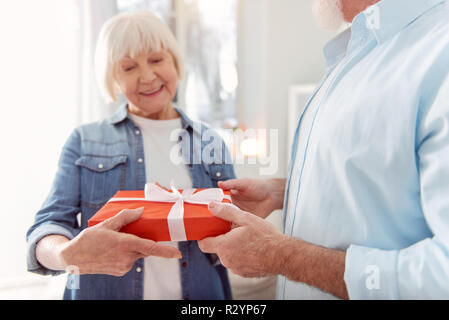 Mature beaming woman smiling happily to the camera Stock Photo