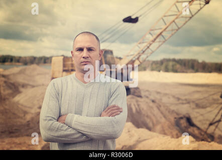 Portrait of worker  at sand pit Stock Photo