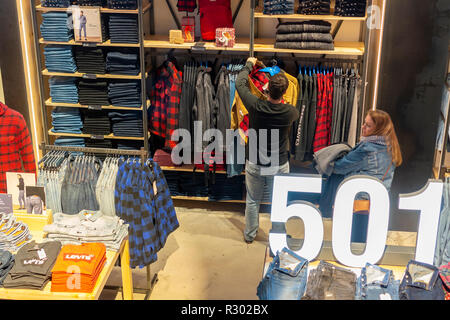 Shoppers search for denim in the Levi Strauss and Co. s new flagship store in Times Square in New York on its grand opening day Friday November 16 2018. The king of blue