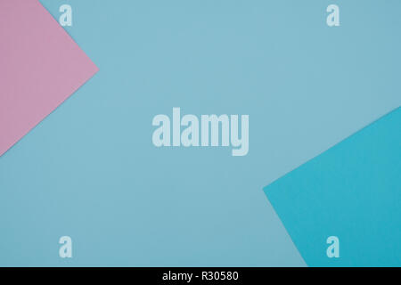 Blue and pink pastel color paper geometric flat lay background - Stock Photo