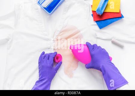 Liquid to remove stains on clothes. Close-up. Stock Photo