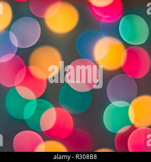 Colorful christmas tree lights bokeh background. Square crop. Stock Photo