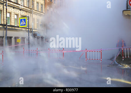 Accident on city street.There was a breakthrough of a heating main with hot water. Stock Photo