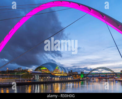 The Gateshead Millennium Bridge looking towards the Sage Gateshead and Tyne Bridge, River Tyne, Newcastle upon Tyne, Tyne and Wear, England, UK Stock Photo