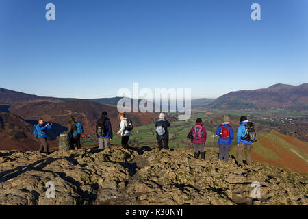 Fell walkers enjoying the wonderful view from the top of Catbells a small mountain near Keswick in the Lake District National Park Stock Photo