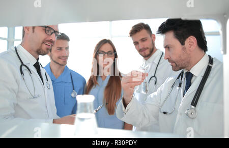 Cheerful young researchers are working in lab Stock Photo