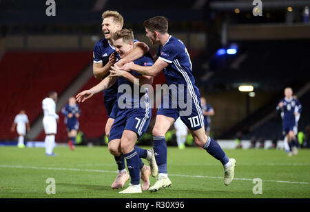 Scotland's James Forrest (centre) celebrates scoring his side's second goal of the game with Stuart Armstrong (left) and Ryan Christie during the UEFA Nations League, Group C1 match at Hampden Park, Glasgow. Stock Photo