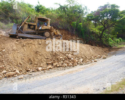 Bulldozer at work in Roatan Island Stock Photo