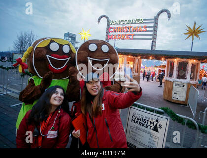 Vancouver, Canada. 20th Nov, 2018. Workers take a selfie at the entrance of the Christmas market in Vancouver, Canada, Nov. 20, 2018. Credit: Liang Sen/Xinhua/Alamy Live News Stock Photo