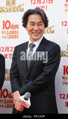 Tokyo, Japan. 21st Nov, 2018. Japanese actor Koji Yakusho attends a promotional event for the 1 billion yen 'Year-end Jumbo lottery' as the first tickets go on sale in Tokyo on Wednesday, November 21, 2018. Thousands punters queued up for tickets in the hope of becoming a billionaire. Credit: Yoshio Tsunoda/AFLO/Alamy Live News Stock Photo