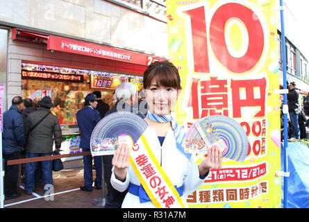 Tokyo, Japan. 21st Nov, 2018. A campaign girl of the lottery Mai Kato displays sample tickets for the 1 billion yen 'Year-end Jumbo lottery' as the first tickets go on sale in Tokyo on Wednesday, November 21, 2018. Thousands punters queued up for tickets in the hope of becoming a billionaire. Credit: Yoshio Tsunoda/AFLO/Alamy Live News Stock Photo