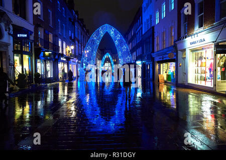 London, UK. 20th Nov 2018. UK Weather: Shoppers walk through the Christmas Lights in the rain on South Molton Street, London. 20th November 2018. Credit: Thomas Bowles/Alamy Live News Stock Photo