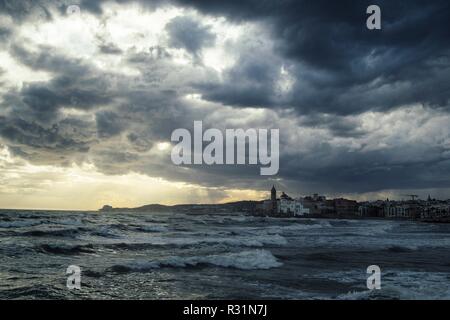 The beautiful town of Sitges, Landscape of the coastline in Sitges before the rain, dramatic sea Stock Photo