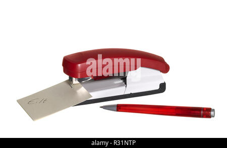 red stapler with paper and pen Stock Photo