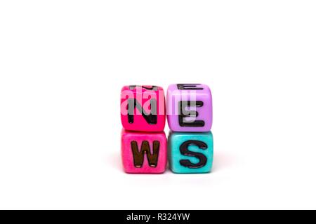 news - word made from multicolored child toy cubes with letters Stock Photo