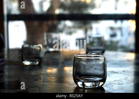Crystal glasses over stone table Stock Photo