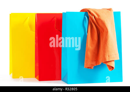three colorful shopping bags with shirt Stock Photo