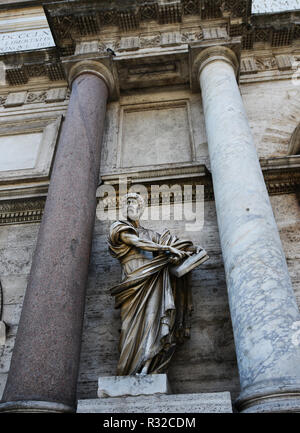 Statue Of Saint Peter By Francesco Mochi On Porta Del Popolo in Rome. Stock Photo