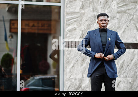 Amazingly looking african american man wear at blue blazer with brooch,  black turtleneck and glasses posed at street. Fashionable black guy with  cup of coffee. 10578847 Stock Photo at Vecteezy
