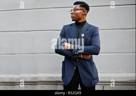 Amazingly looking african american man wear at blue blazer with brooch,  black turtleneck and glasses posed at street. Fashionable black guy.  10537661 Stock Photo at Vecteezy