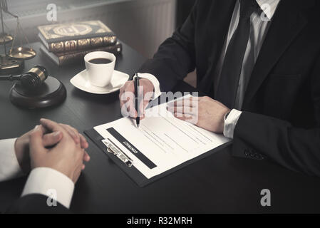 Male lawyer working with contract papers. Lawyer or judge consult, meeting with client. Law and Legal services concept Stock Photo