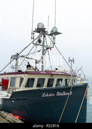 Lobster boats sit in a protected cove at Cape Forchu, Nova Scotia, Canada. Stock Photo