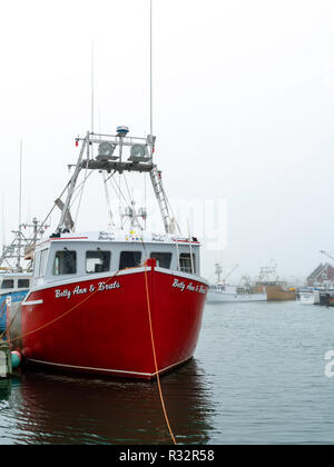 Lobster boats sit in a protected cove at Cape Forchu, Nova Scotia, Canada. Stock Photo