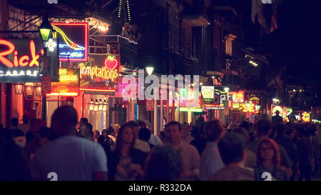 NEW ORLEANS, LOUISIANA - MAY 6th: Unidentified people on Bourbon Street at night in the historic French Quarter of New Orleans, Louisiana on May 6th,  Stock Photo