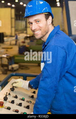 construction worker uses a machine Stock Photo