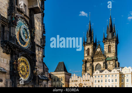 'Prazsky orloj', the astronomical clock of Prague's town hall, with the towers of 'Tynsky chram', the Tyn Church, in the background Stock Photo