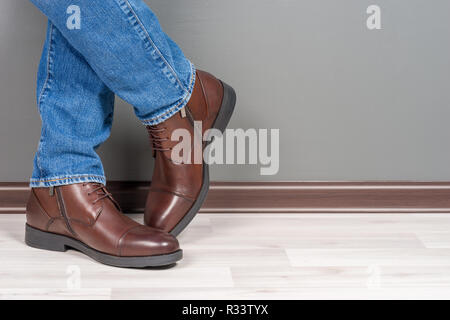 Boots men on white wooden floor Stock Photo