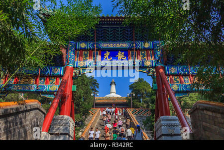 Beijing, China - September 20, 2013: People on the steps leading to Bai Ta (White Pagoda or Dagoba) stupa in Buddhist Yong An Temple of Everlasting Pe Stock Photo