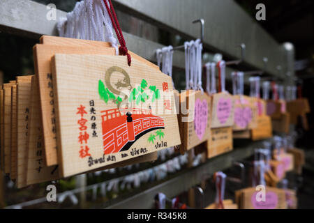 Wooden Ema wooden prayer plaques at Nikko Futarasan jinja in Nikko, Japan. You write your wishes on the plaque and then hang it. Stock Photo