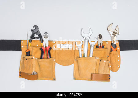 top view of tool kit belt with different repairman instruments isolated on white Stock Photo