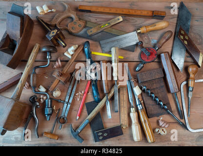 Carpenters tools on woodworking bench Stock Photo