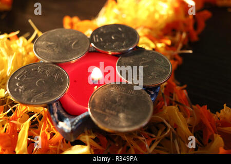 A close- up view of single lit diya for celebrating diwali and dhanteras festival in India Stock Photo