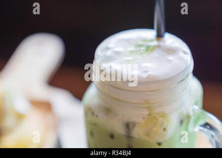 Close up Green tea cold, in the cafe. Stock Photo