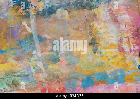 artistic multicolored blots on recycled brown paper background texture Stock Photo