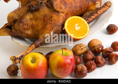 roast goose with chestnuts,apples and oranges Stock Photo