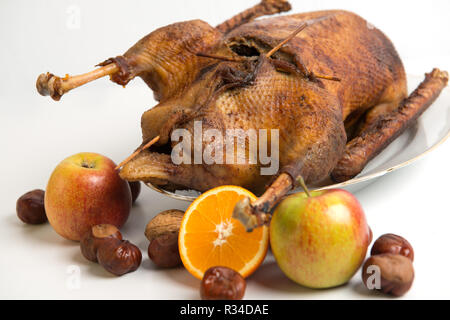 roast goose with chestnuts,apples and orange Stock Photo