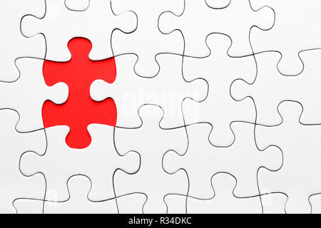 missing puzzle piece in red Stock Photo