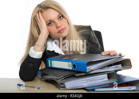 pensive woman over folder mountain Stock Photo