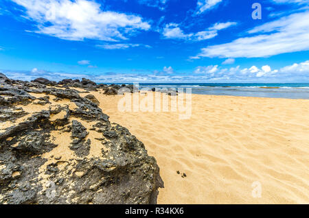 Large rocks along a beach in Kauai, Hawaii Stock Photo