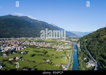 Adda river and city of Morbegno. Valtellina. Aerial shot Stock Photo